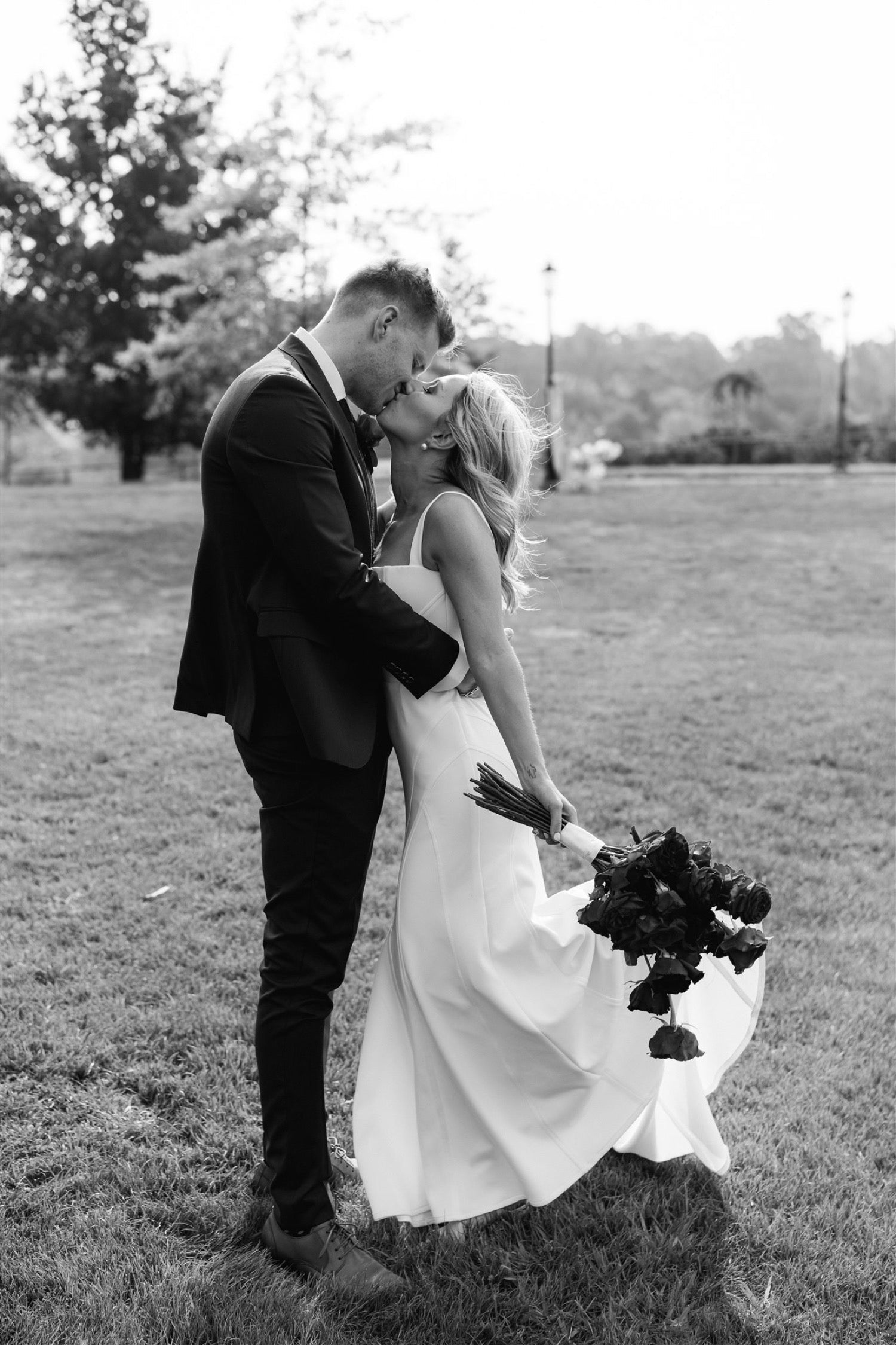 Bride in country wedding wearing Amélie George bridal pearl wedding earrings and a fingertip wedding veil with Georgia Young Couture wedding dress..