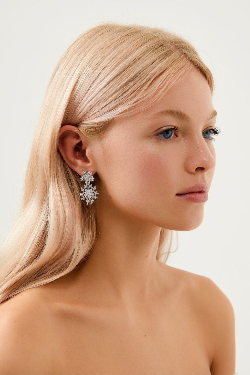 Crystal flower drop wedding earrings worn by bride — statement bridal earrings Melbourne