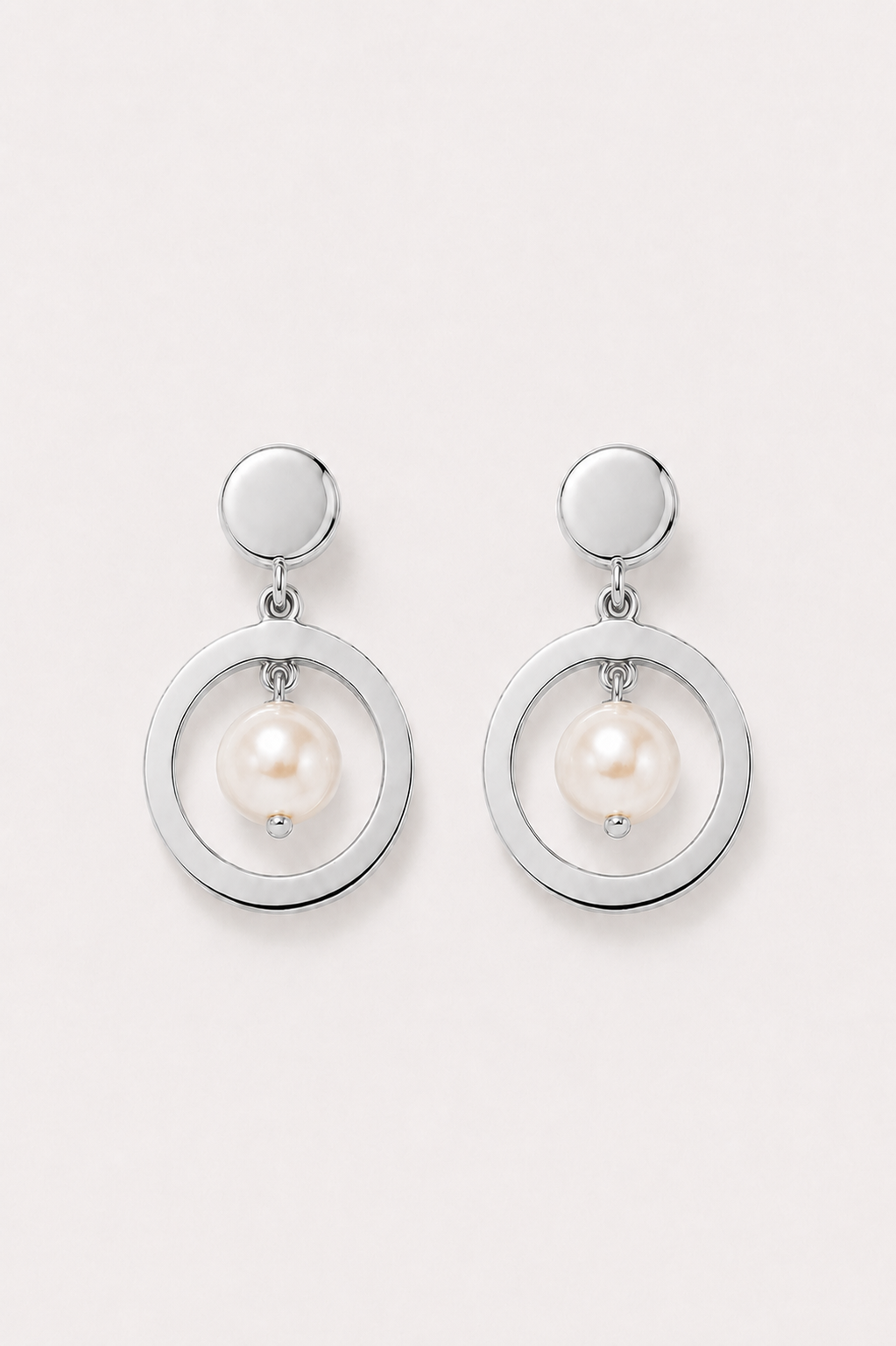 Silver earrings with pearl on a white background
