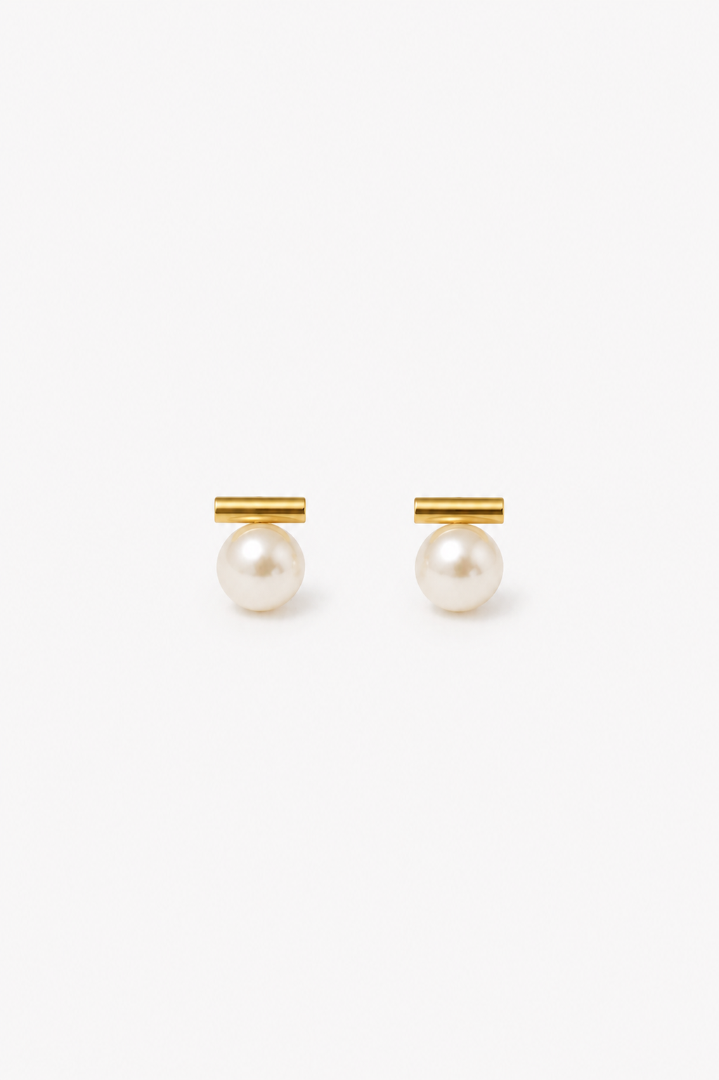Pair of pearl earrings with gold accents on a white background
