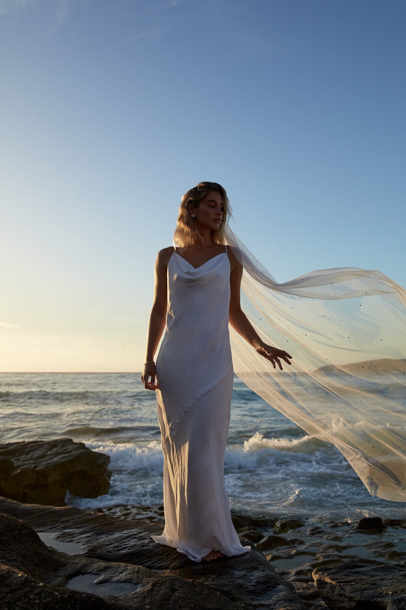 Elegant bride in a lightweight bridal veil with scattered crystals, perfectly complementing her wedding gown.