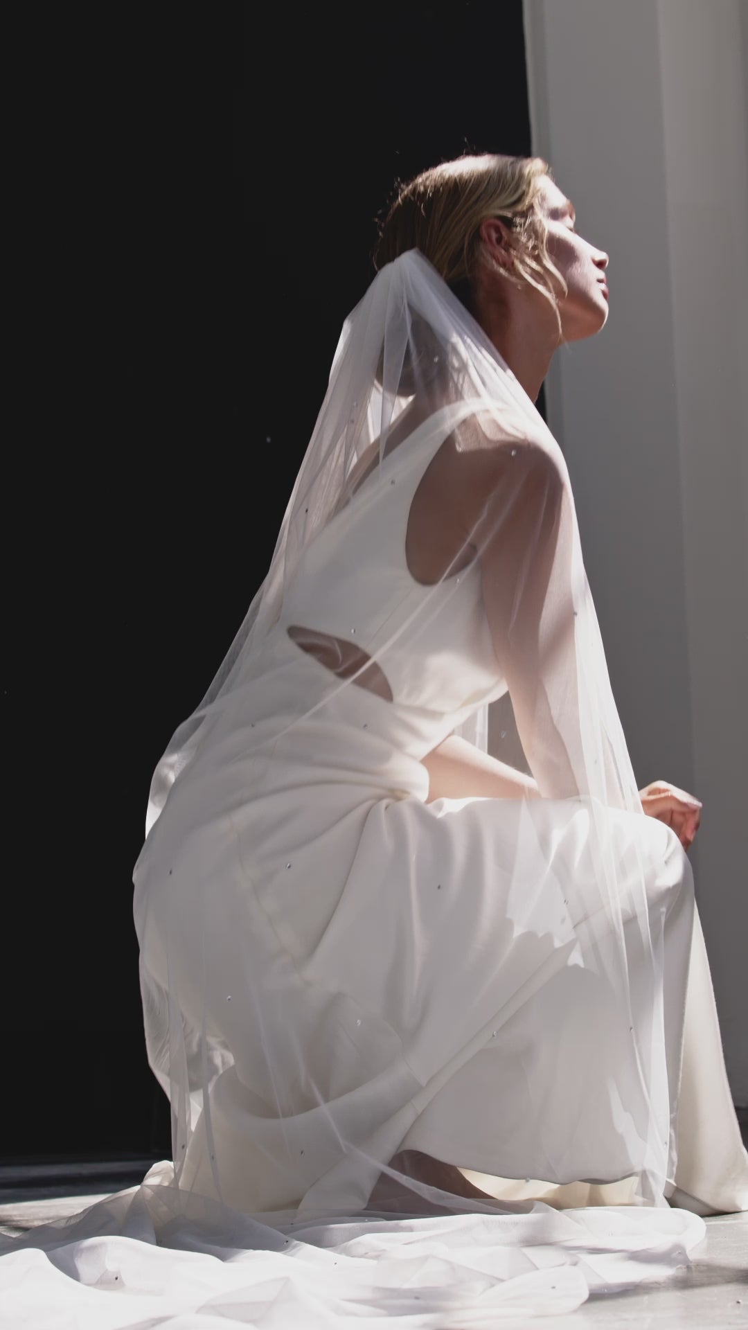 Video of Bride in a stunning crystal wedding veil, showcasing a timeless and sophisticated bridal accessory.