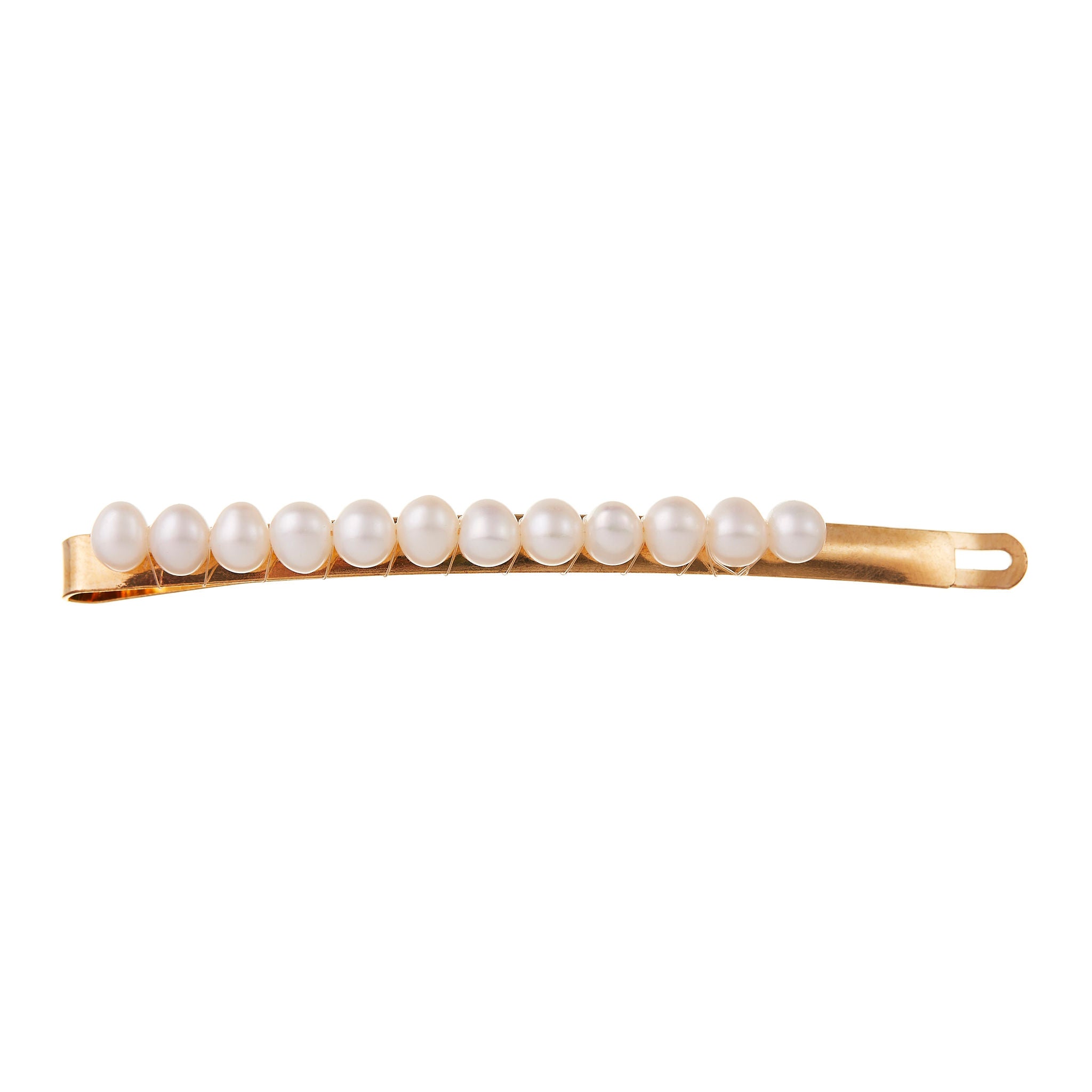 Hair clips for wedding hair in gold, adorned with pearls for a sophisticated bridal finish.