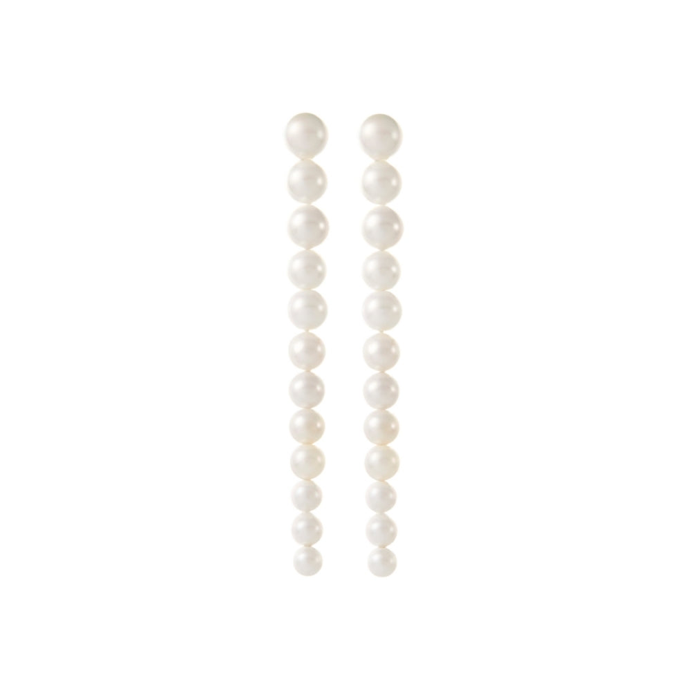 OLYMPIA pearl drop earrings in gold, a sophisticated choice for wedding jewelry, combining a bold silhouette with the softness of pearls.