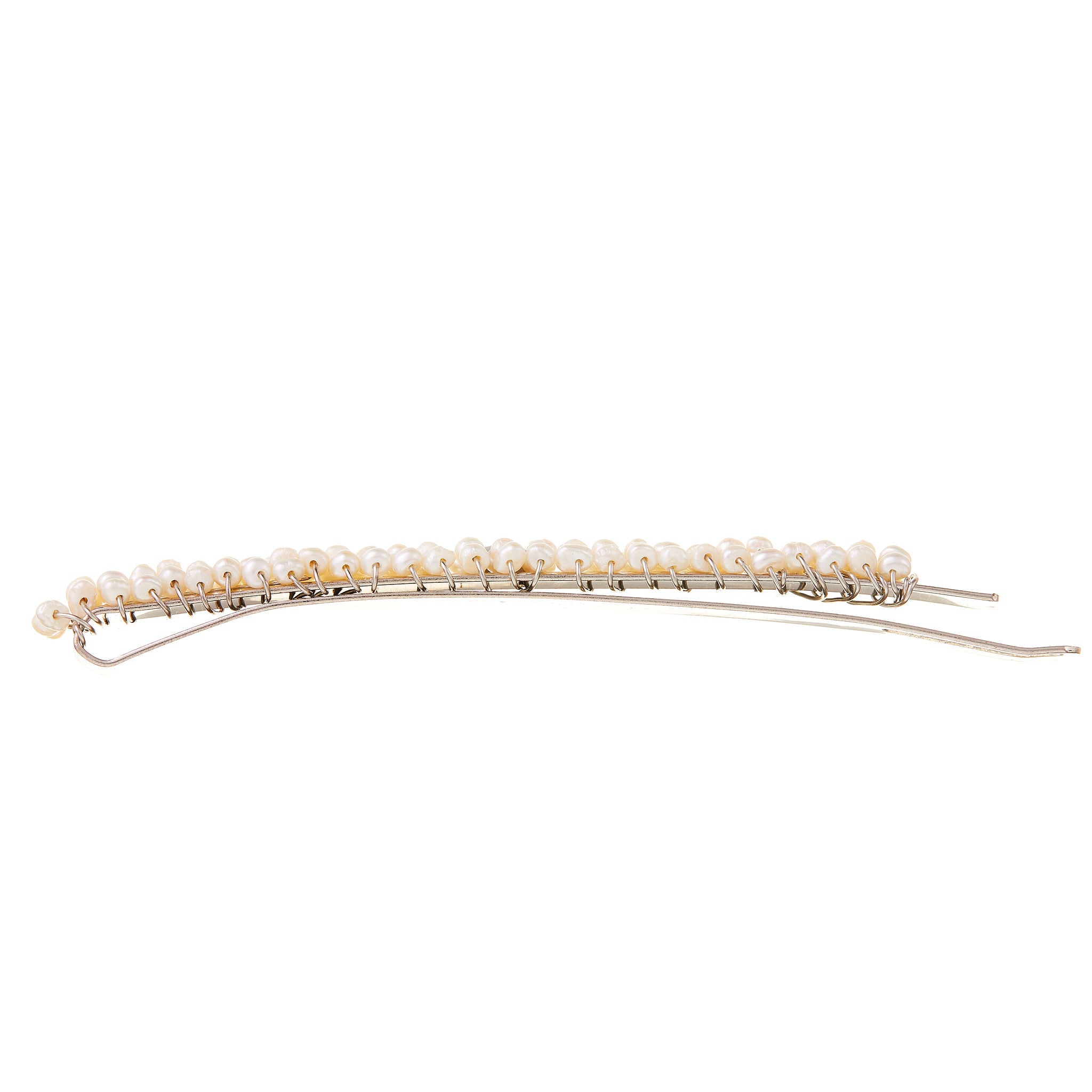 Silver bridal headpiece featuring pearls, beautifully paired with a backless dress for a chic bridal look on your special day.