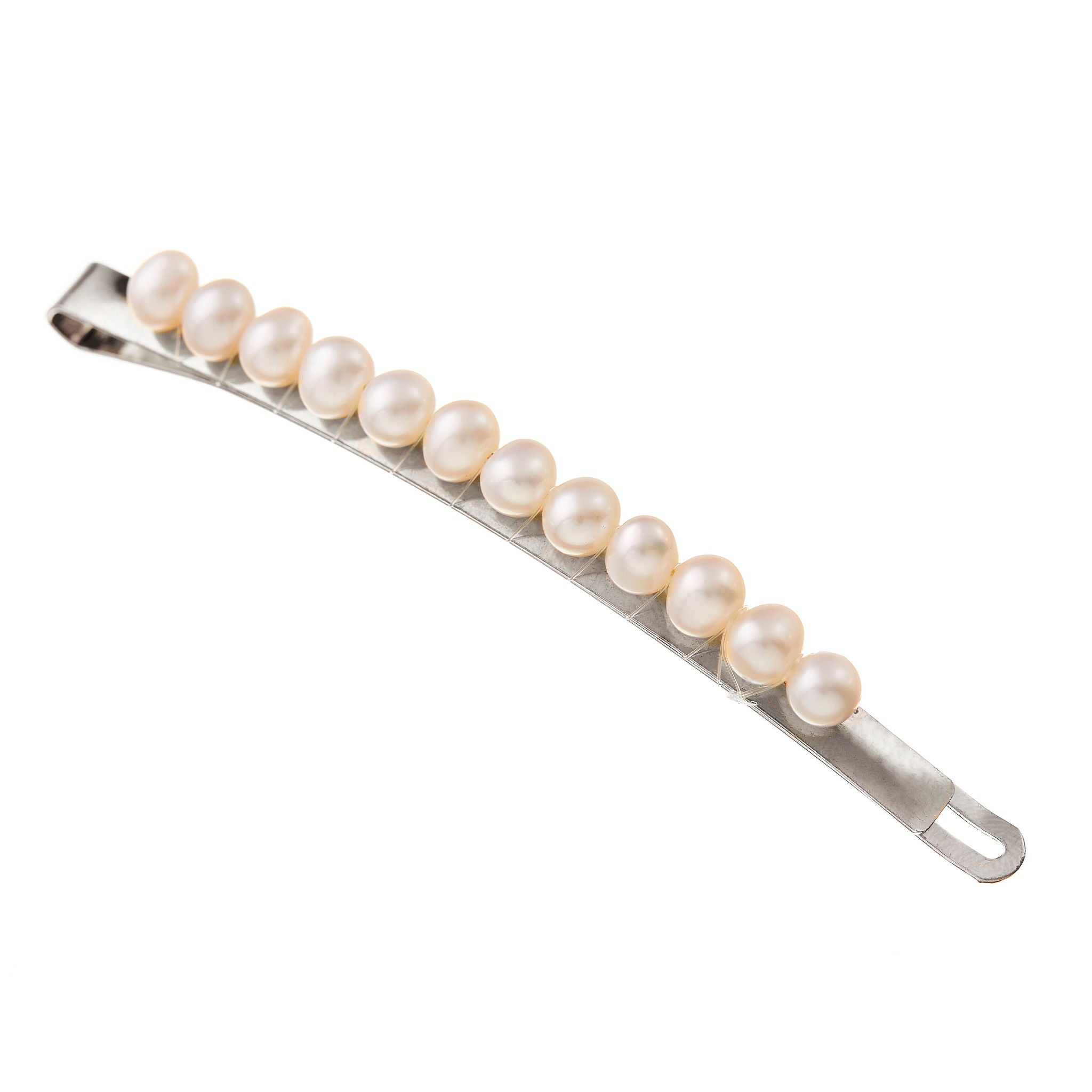 Stunning hair clips for wedding hair in silver, with luminous pearls to elevate your bridal style.