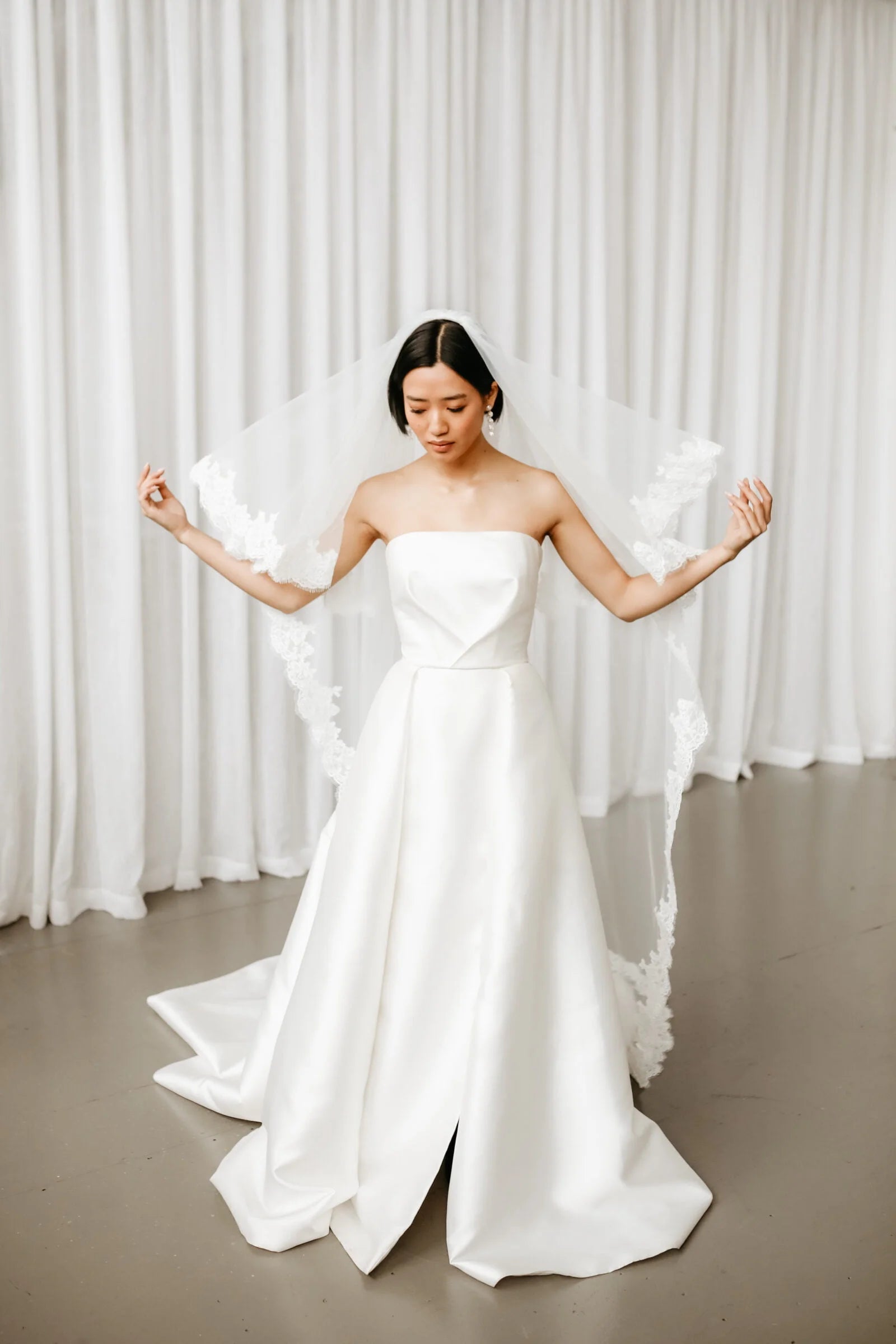 Romantic bridal look with a lace wedding veil with blusher, designed with vintage-inspired lace details and soft elegance.