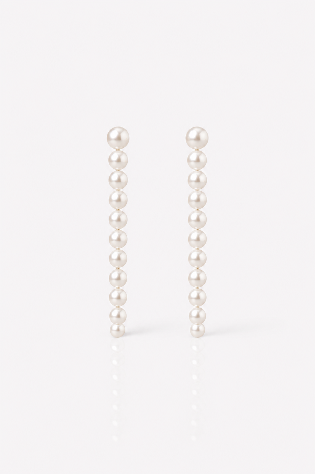 Pair of extra long statement pearl wedding earrings