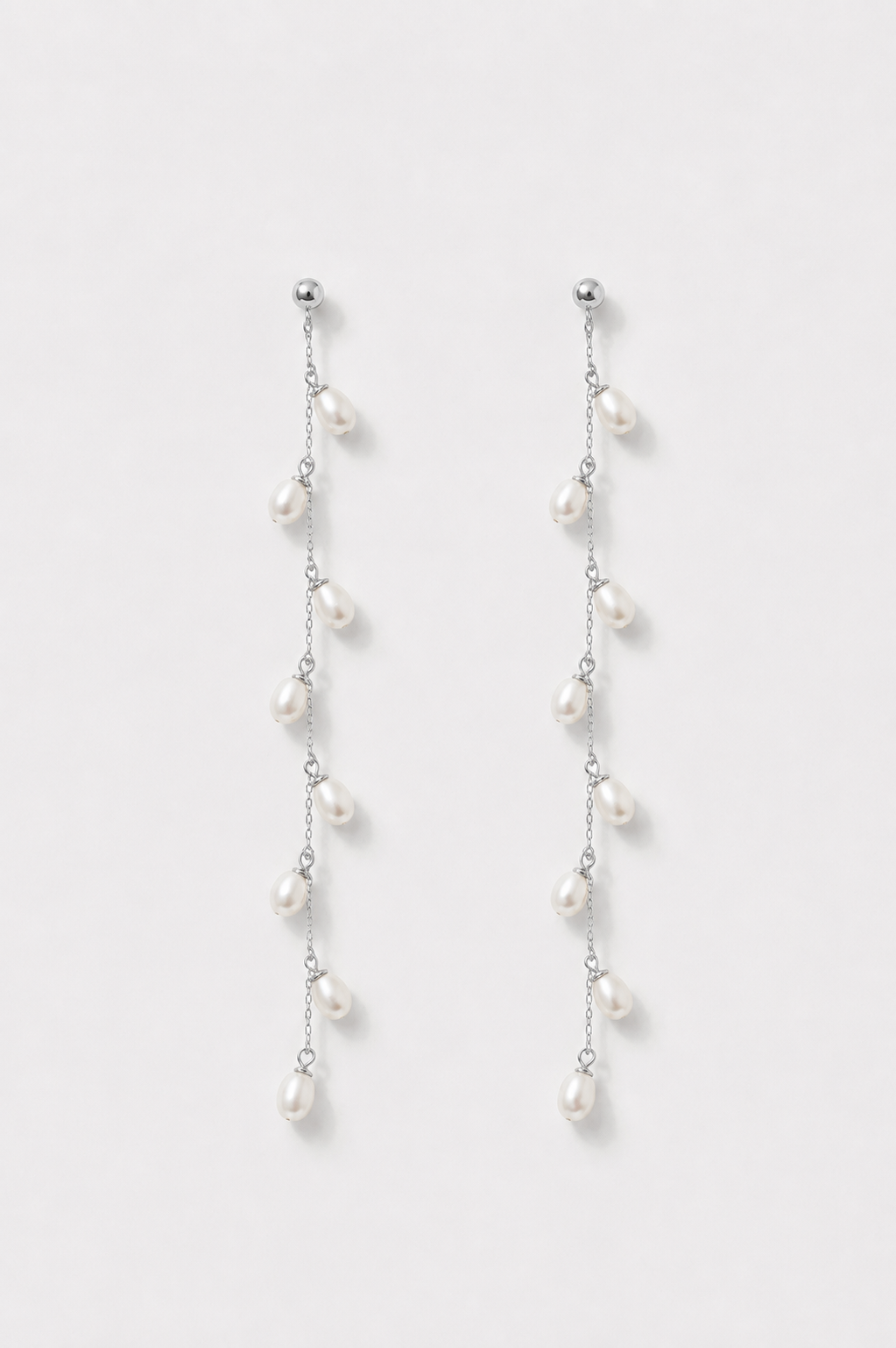Silver pearl dangle earrings with freshwater pearls. 