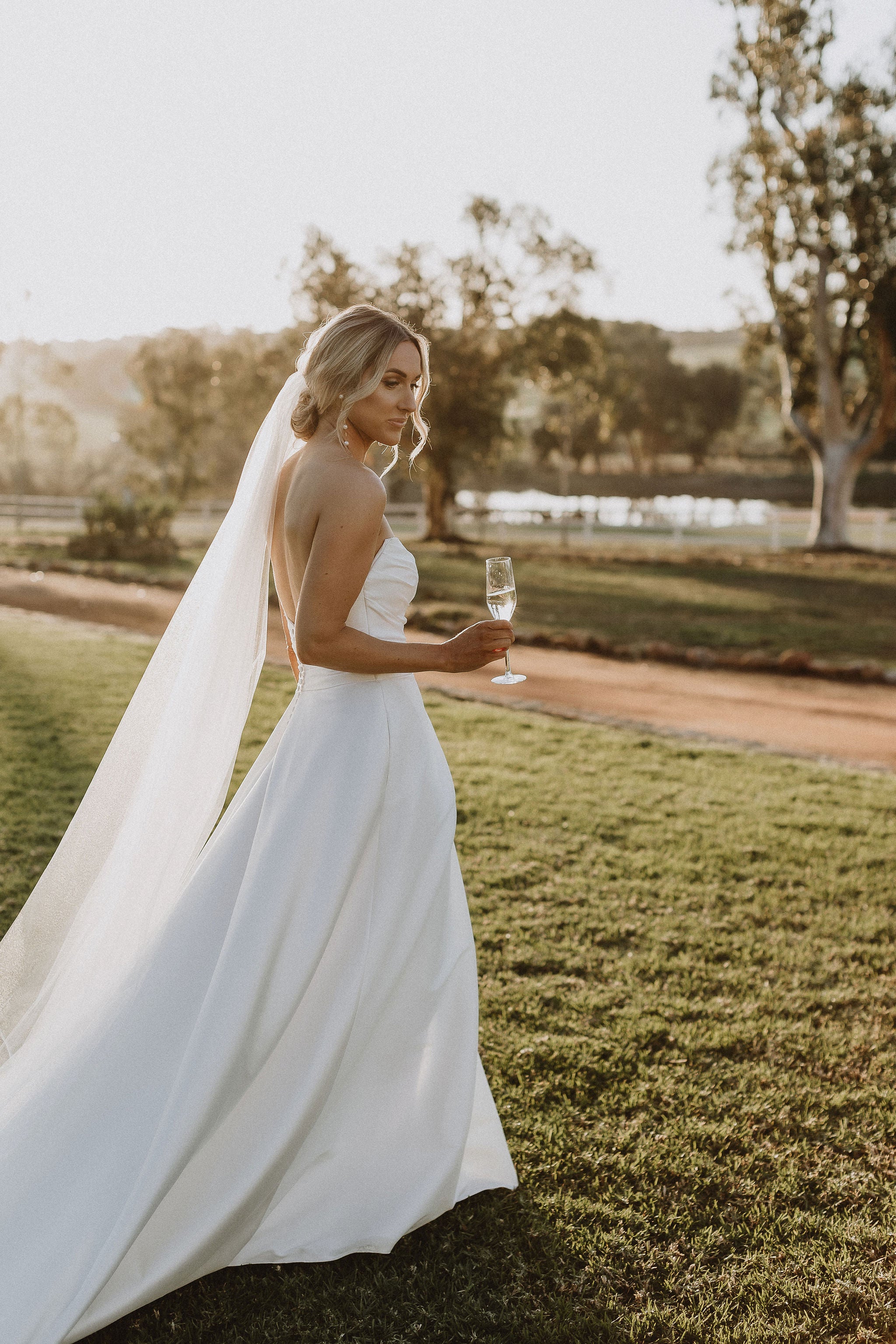 Long pear wedding earrings on bride