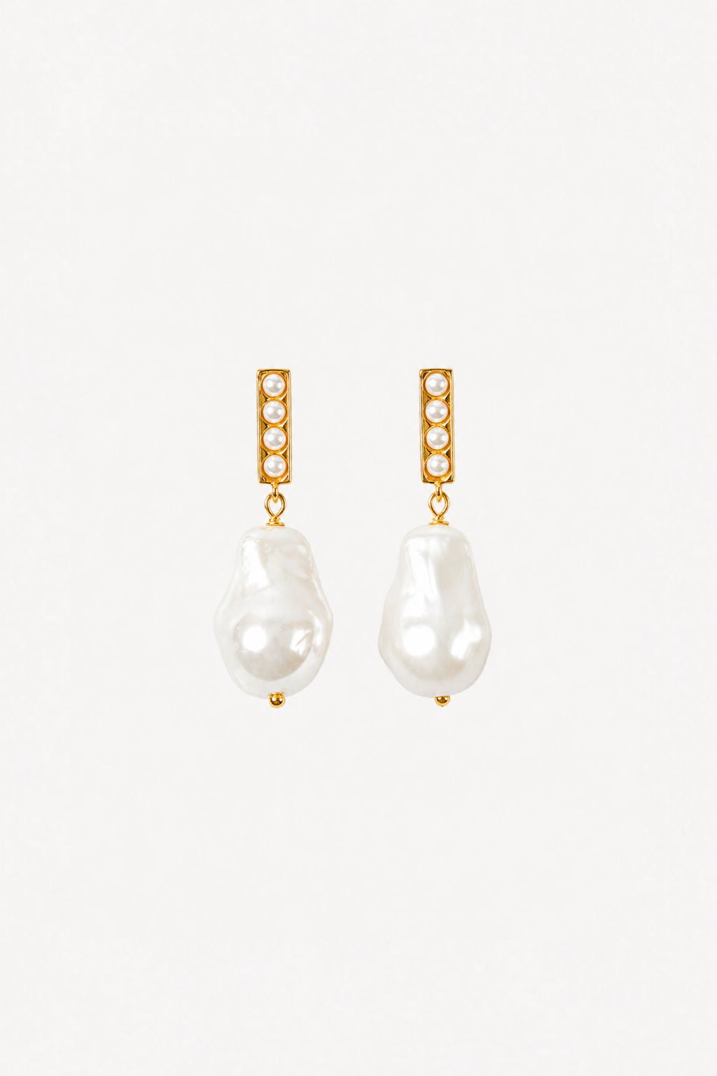 Pair of pearl earrings with gold accents on a white background