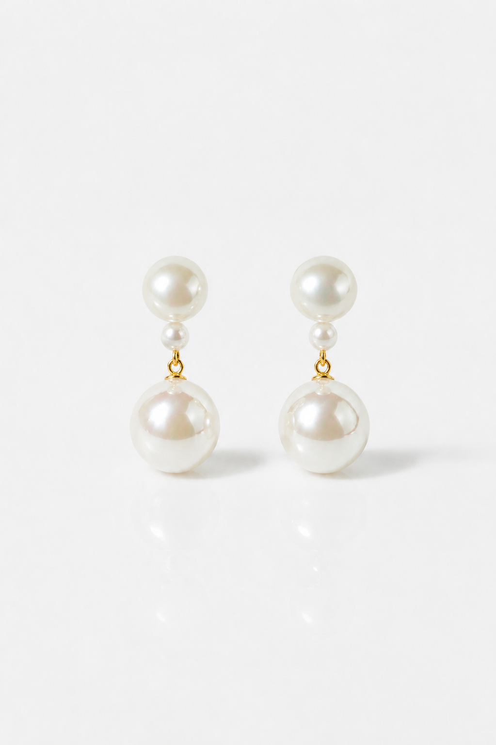 Pair of pearl earrings on a white background