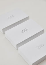 Image of white gift box with amelie george wedding jewellery logo on the top to shop gift packaging offered free for every purchase.