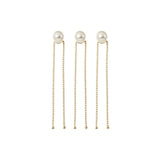 3 natural freshwater pearl hairpins on 18k gold hairstylist pins are organised in a perfect row.