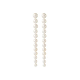 Pearl freshwater wedding earrings with large pearls at top and small cascading pearls at the bottom on a white background.