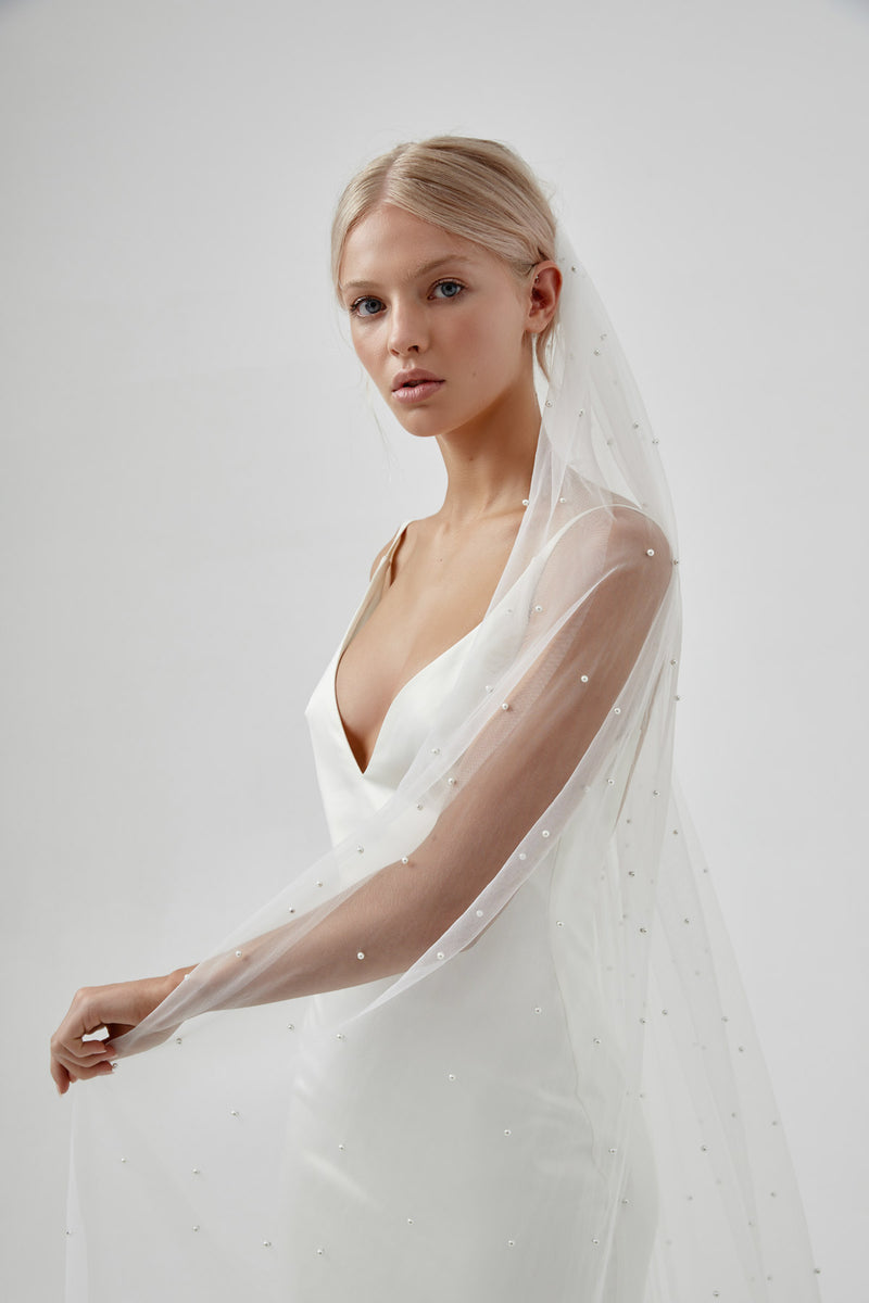 Modern Pearl Wedding Veil on a blonde bride with natural updo and natural wedding makeup by Amelie George Bridal