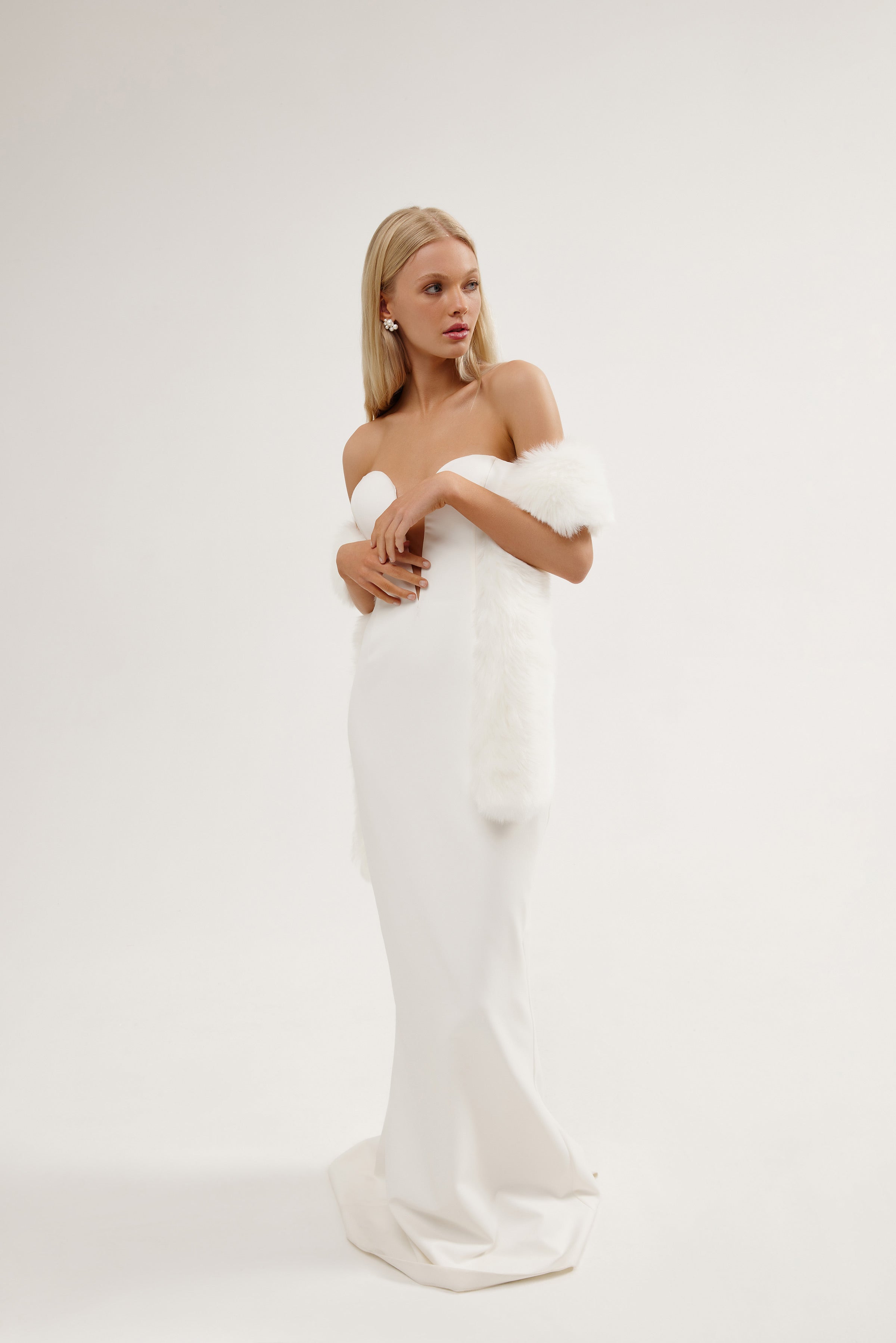 Elegant bride styled in a small vegan fur wedding shawl, perfect for a cool weather ceremony