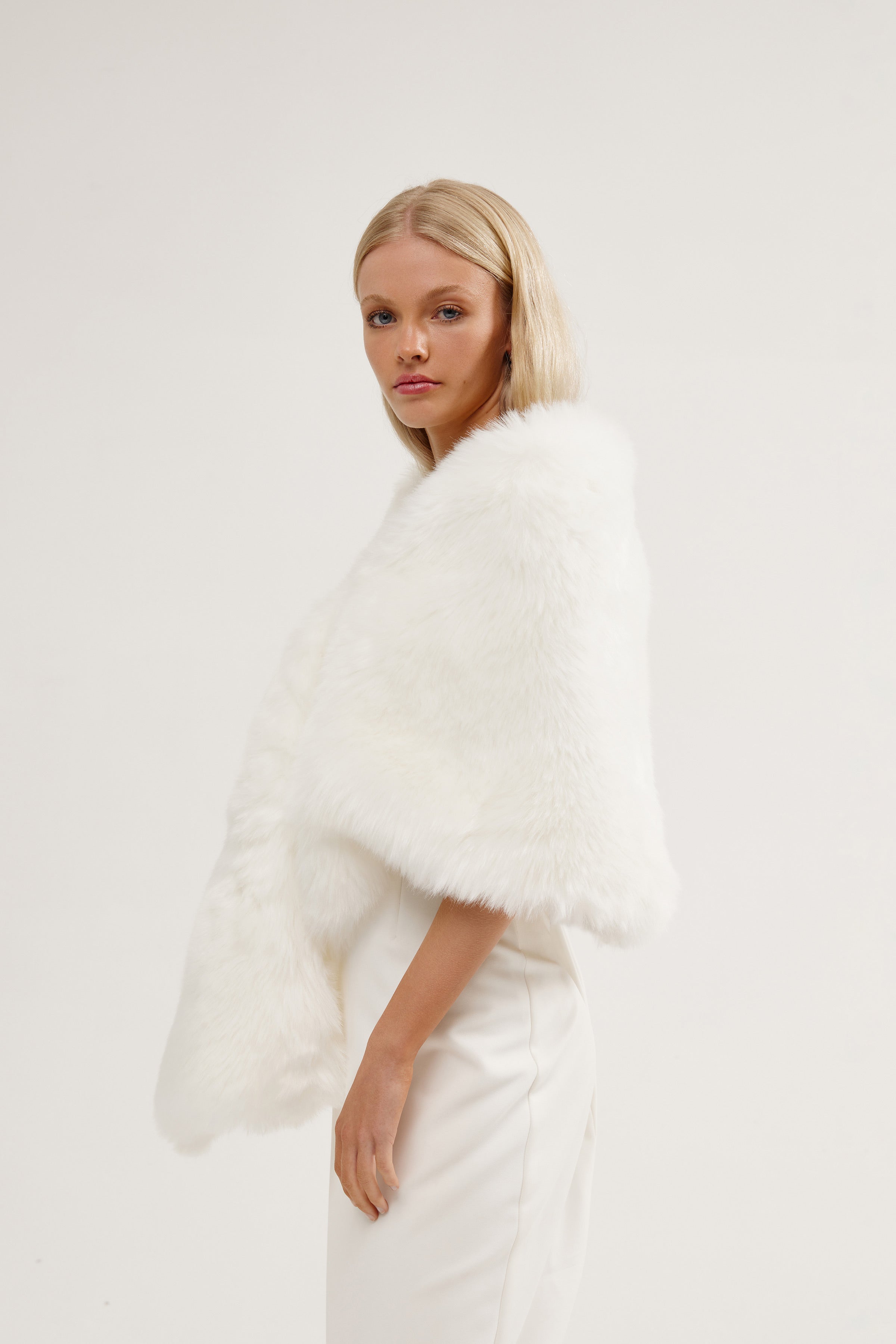 Elegant bride styled in a large vegan fur wedding shawl, perfect for a cold-weather ceremony